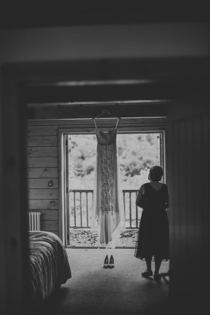 Mother admiring wedding gown