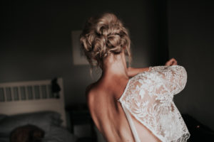 Bride wearing lace open back top