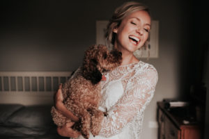 Bride holding her dog